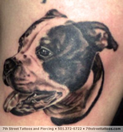 Tattoo of a dog by tattooist Robert Berry from Seventh Street Tattoos in 